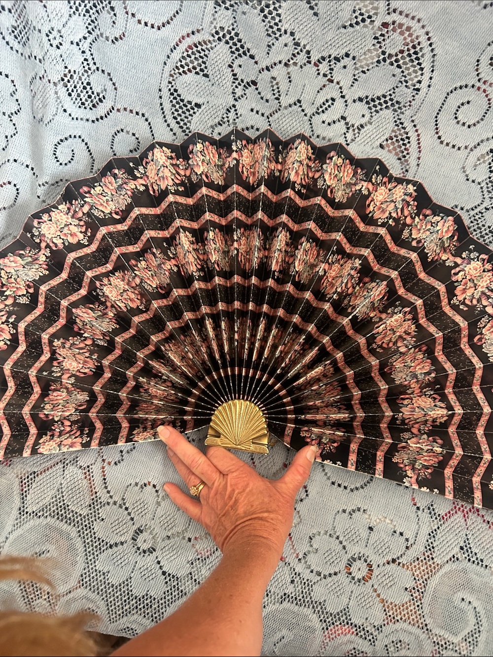 Vintage decorative paper fan with gold shell base